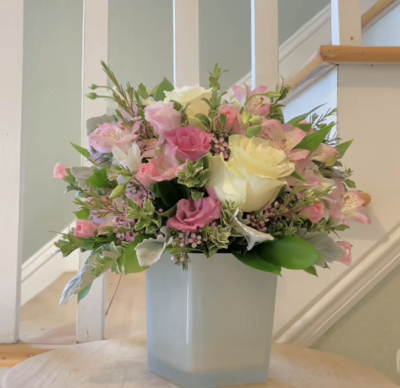 Eternal Love - A gorgeous arrangement comprising of spray roses, alstromeria, wax flower, and mix greenery.